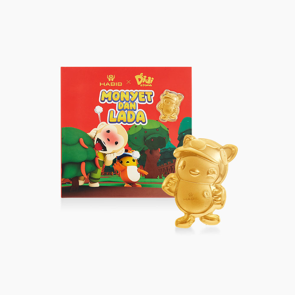 Gold figurine of a cartoon character with a colorful packaging in the background